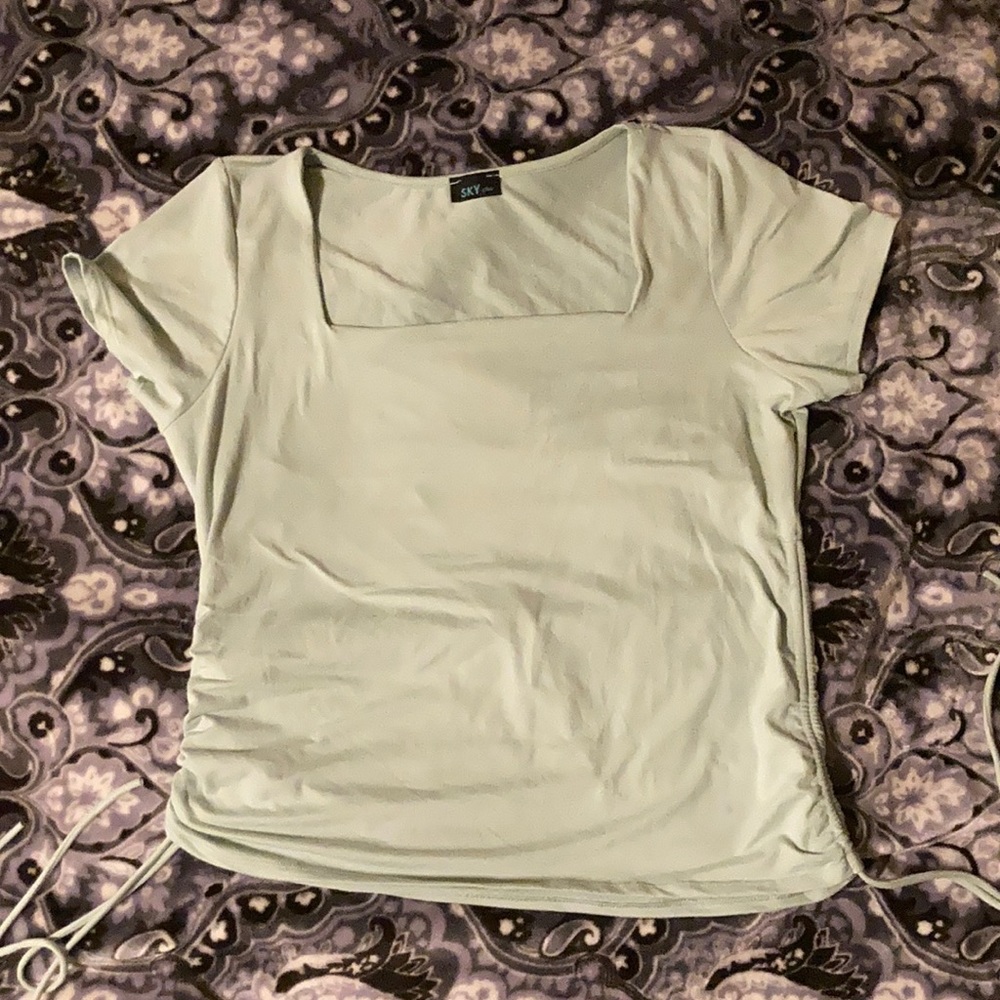 Pastel green blouse, square shaped neck opening, adjustable scrunching on sides